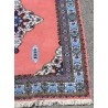Pink Moroccan wool rug with a blue border