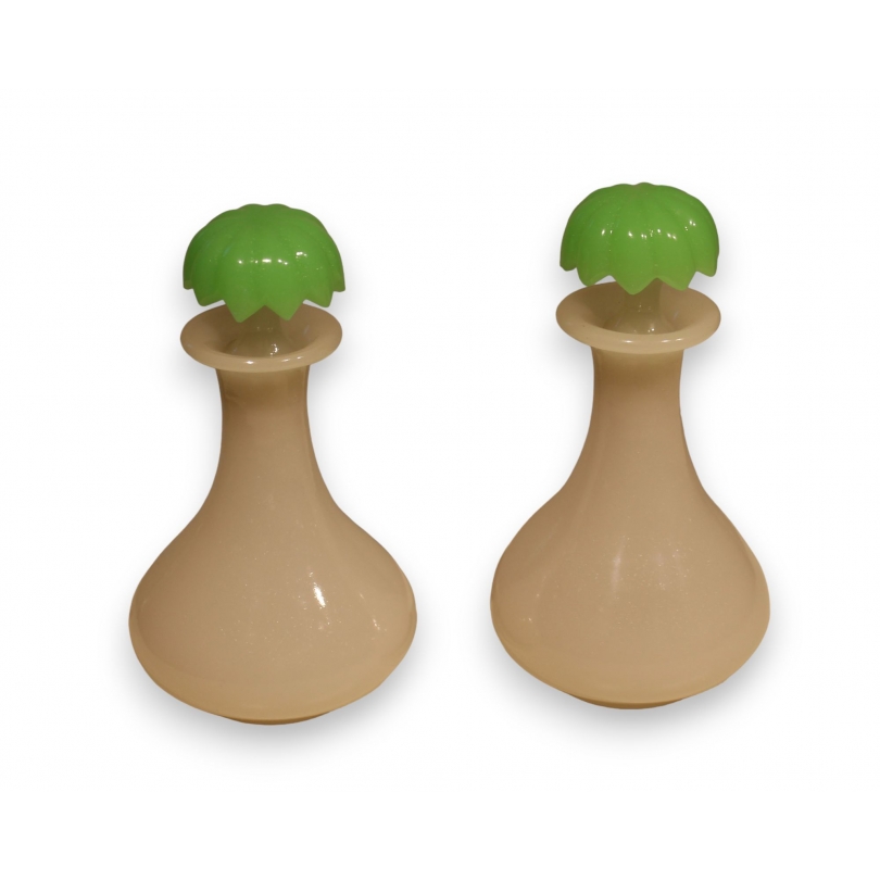 A pair of green and white opaline bottles