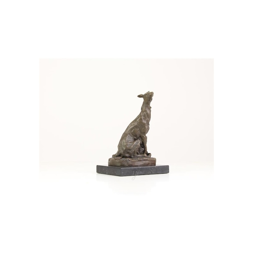 Seated bronze levir, on a black marble plinth