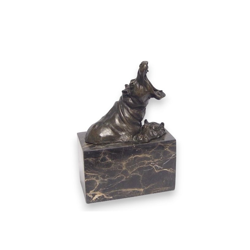 Two bronze hippos, on a black marble plinth