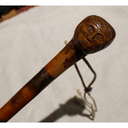 Walking stick with a carved head