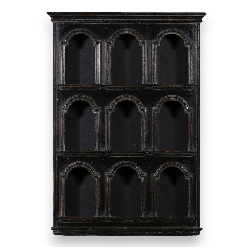 Shelf with arched openings