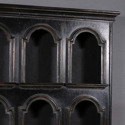 Shelf with arched openings