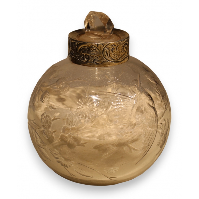 Clear crystal bottle with a floral design