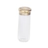 Toiletries bottle with a vermeil-plated cap