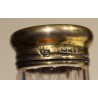 Toiletries bottle with a vermeil-plated cap