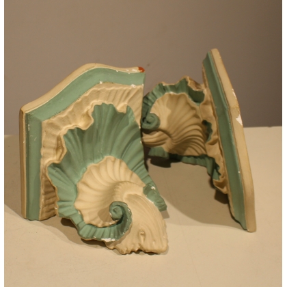 A pair of blue and white plaster side tables