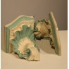 A pair of blue and white plaster side tables