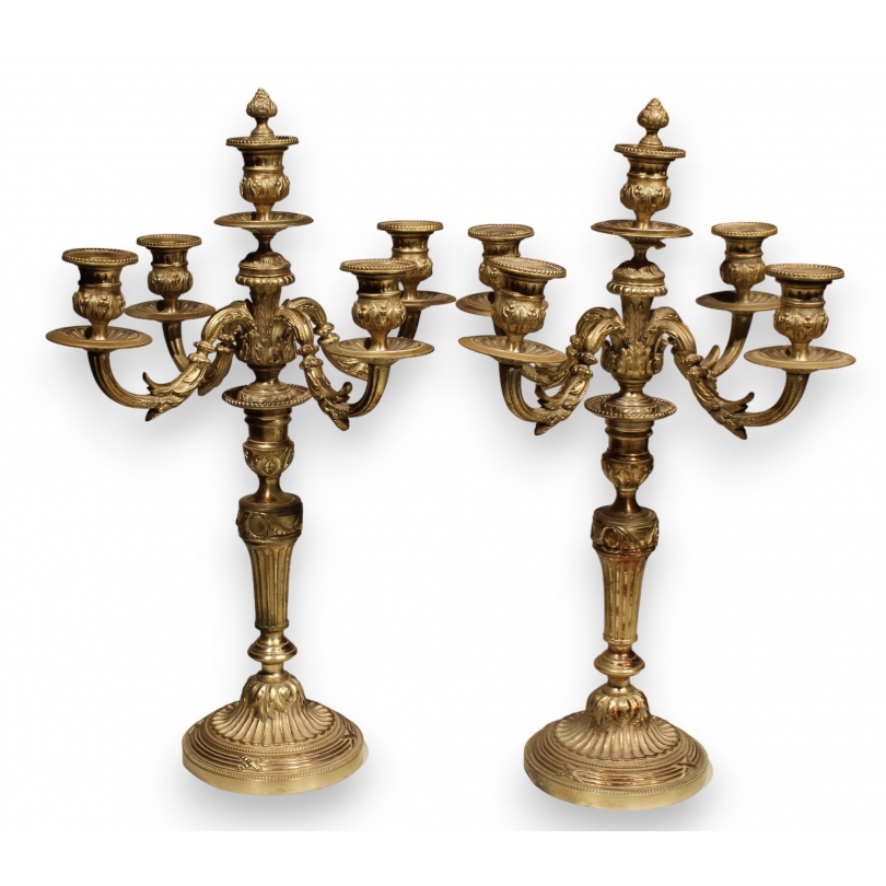 A pair of Louis XVI candlesticks in silver-plated bronze