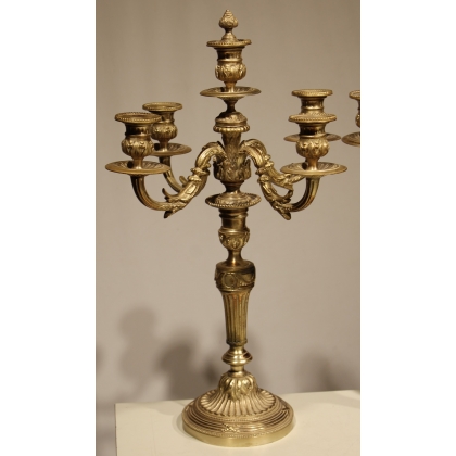 A pair of Louis XVI candlesticks in silver-plated bronze