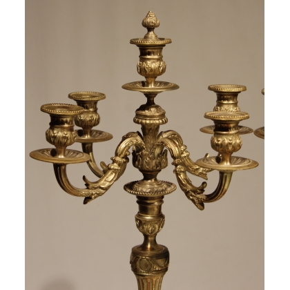A pair of Louis XVI candlesticks in silver-plated bronze
