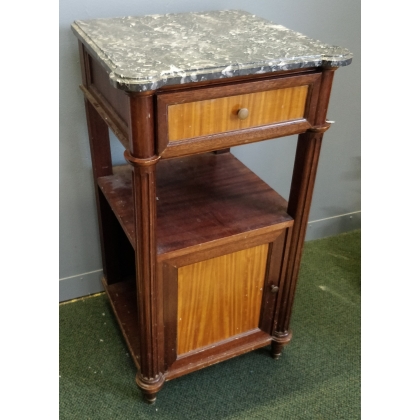 A pair of Louis XVI-style bedside tables with marble tops