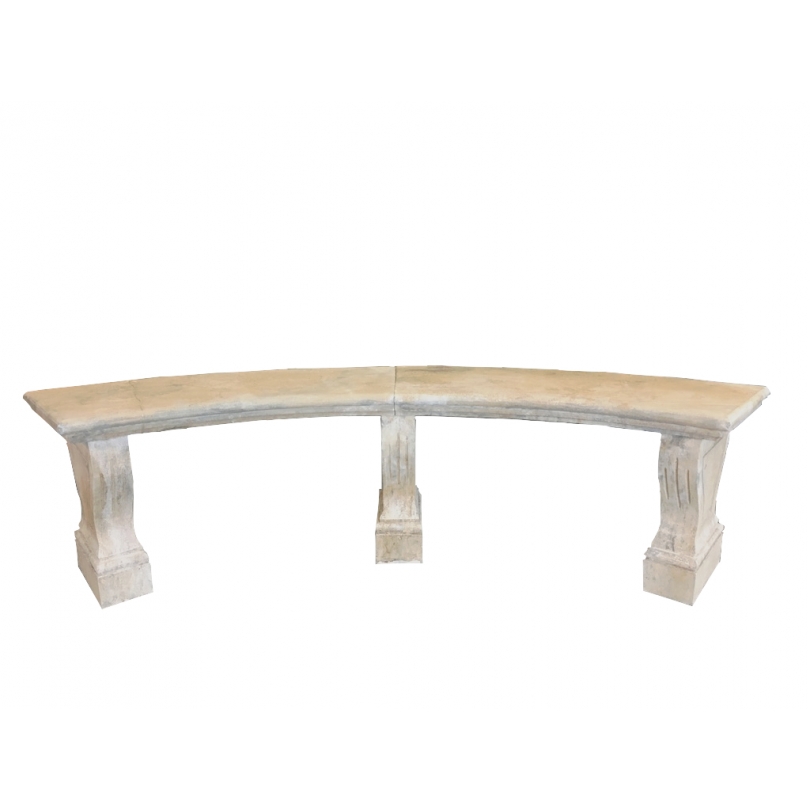 Three-legged curved bench made of carved stone