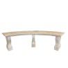 Three-legged curved bench made of carved stone
