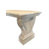 Three-legged curved bench made of carved stone
