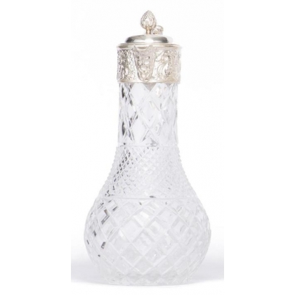 Crystal carafe with a silver-coloured metal spout