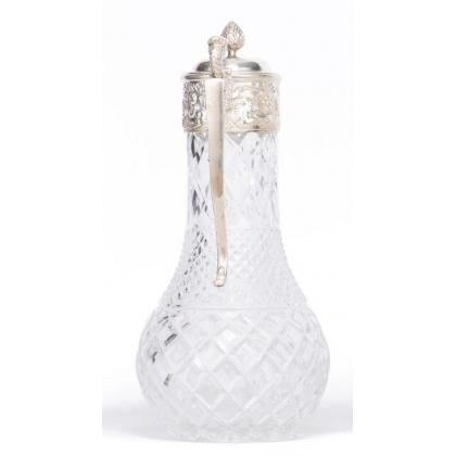 Crystal carafe with a silver-coloured metal spout