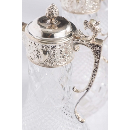 Crystal carafe with a silver-coloured metal spout