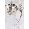 Crystal carafe with a silver-coloured metal spout