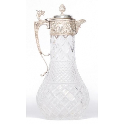 Crystal carafe with a silver-coloured metal spout