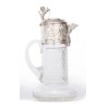 Crystal carafe with a silver-coloured metal spout