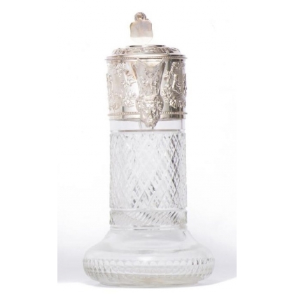 Crystal carafe with a silver-coloured metal spout