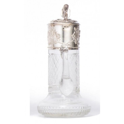 Crystal carafe with a silver-coloured metal spout