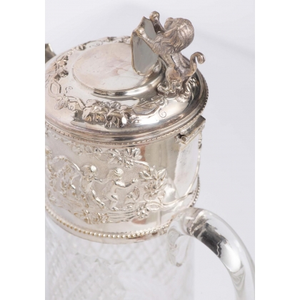 Crystal carafe with a silver-coloured metal spout