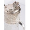 Crystal carafe with a silver-coloured metal spout