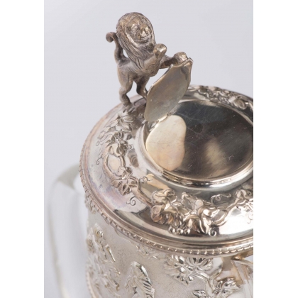 Crystal carafe with a silver-coloured metal spout
