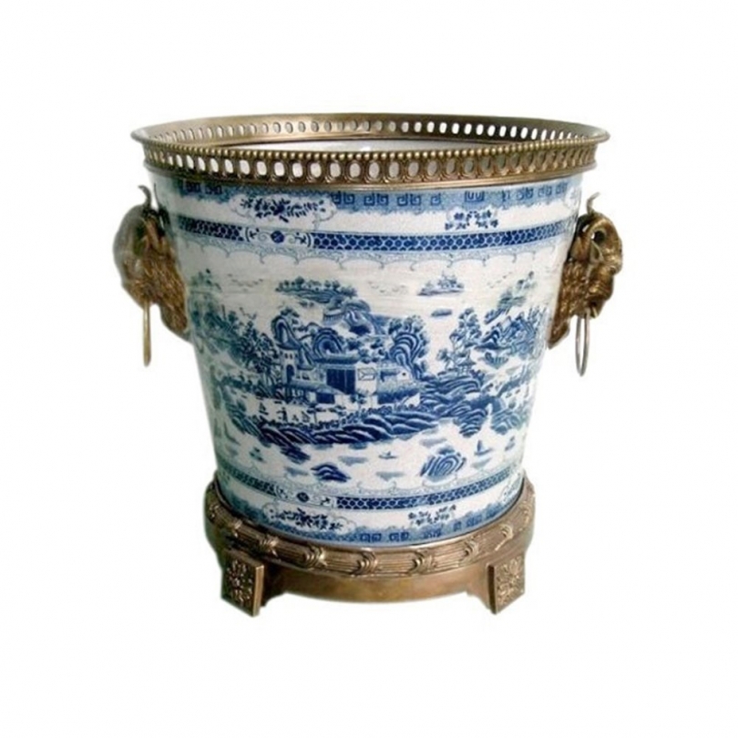 Blue and white plant pot with bronze trim