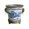 Blue and white plant pot with bronze trim