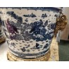 Blue and white plant pot with bronze trim