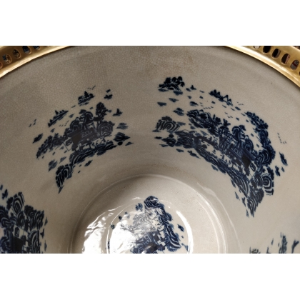 Blue and white plant pot with bronze trim