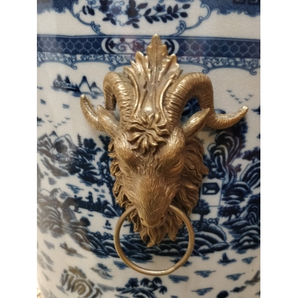 Blue and white plant pot with bronze trim