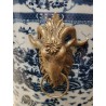 Blue and white plant pot with bronze trim