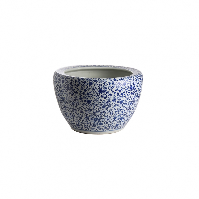 Blue and white plant pot with a floral design