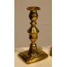 A pair of brass candlesticks by John Turner & Co