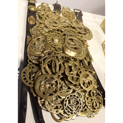A collection of 103 brass harness fittings