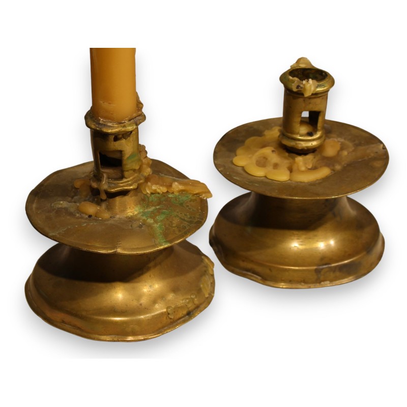 A pair of bronze candlesticks