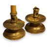 A pair of bronze candlesticks