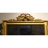 Miroir style Louis XVI fronton noeud en bois doré