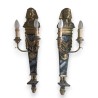 A pair of wall lights made of painted and gilded wood