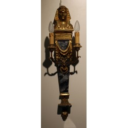 A pair of wall lights made of painted and gilded wood