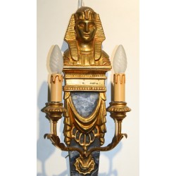 A pair of wall lights made of painted and gilded wood
