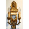 A pair of wall lights made of painted and gilded wood