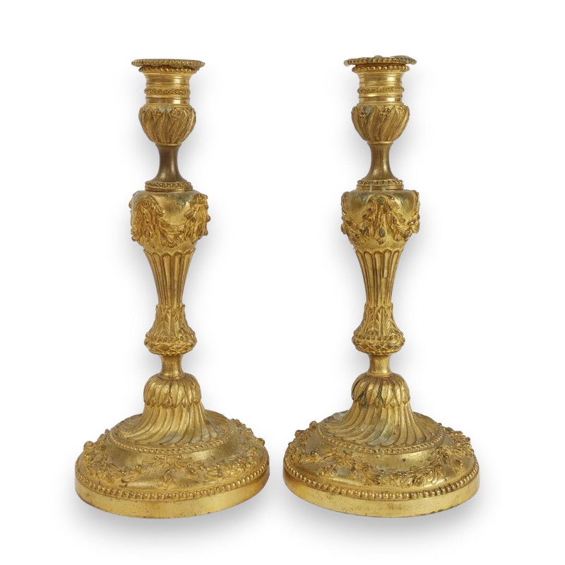 A pair of Louis XVI-style candlesticks