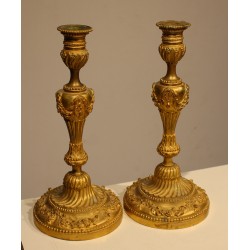 A pair of Louis XVI-style candlesticks