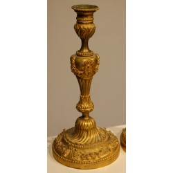 A pair of Louis XVI-style candlesticks