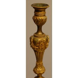 A pair of Louis XVI-style candlesticks